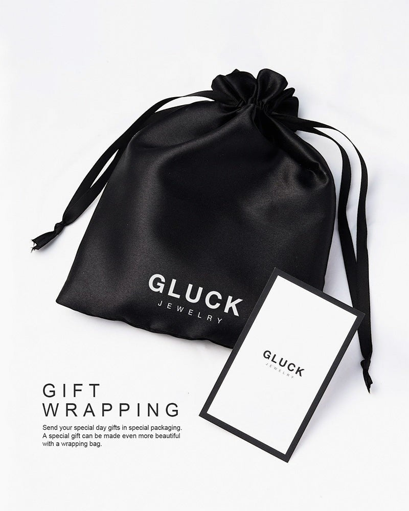 GLUCK(グルック)のロゴ入り黒いサテン製ギフトラッピング用巾着袋とショップカード
